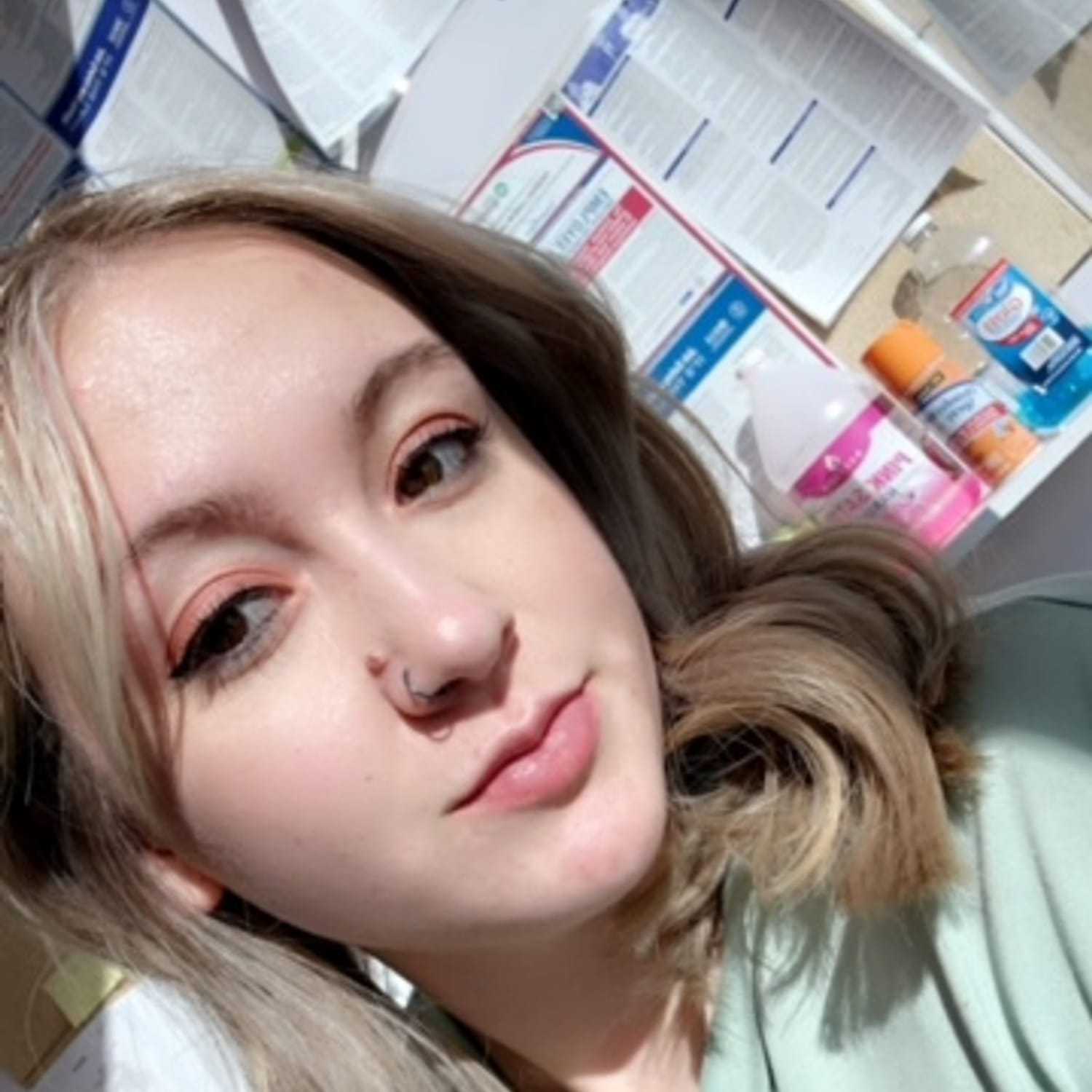 Portrait of Cayleigh Gallagher, a professional stylist at Alluring Designs A Salon, showcasing their expertise and style.