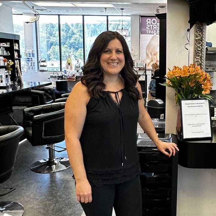 Portrait of Brianne Young, a professional stylist at Alluring Designs A Salon, showcasing their expertise and style.