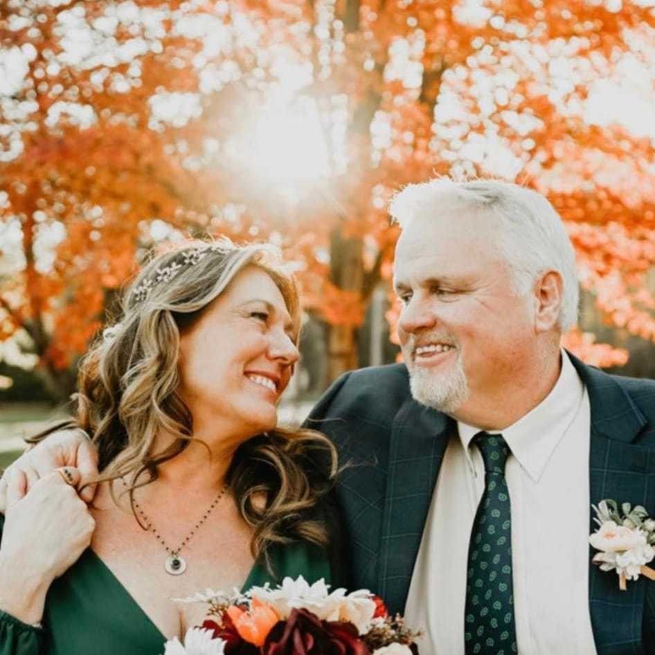 Portrait of Kim Higham, a professional stylist at Alluring Designs A Salon, showcasing their expertise and style.