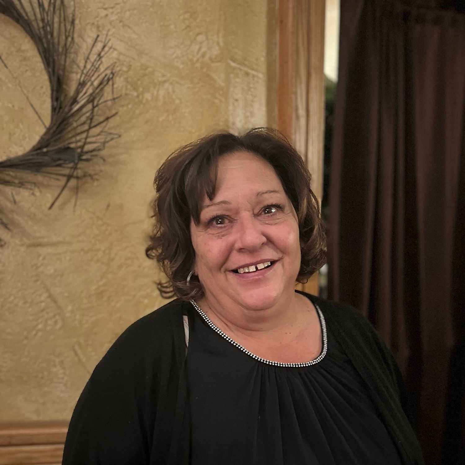 Portrait of Sherry Cook, a professional stylist at Alluring Designs A Salon, showcasing their expertise and style.